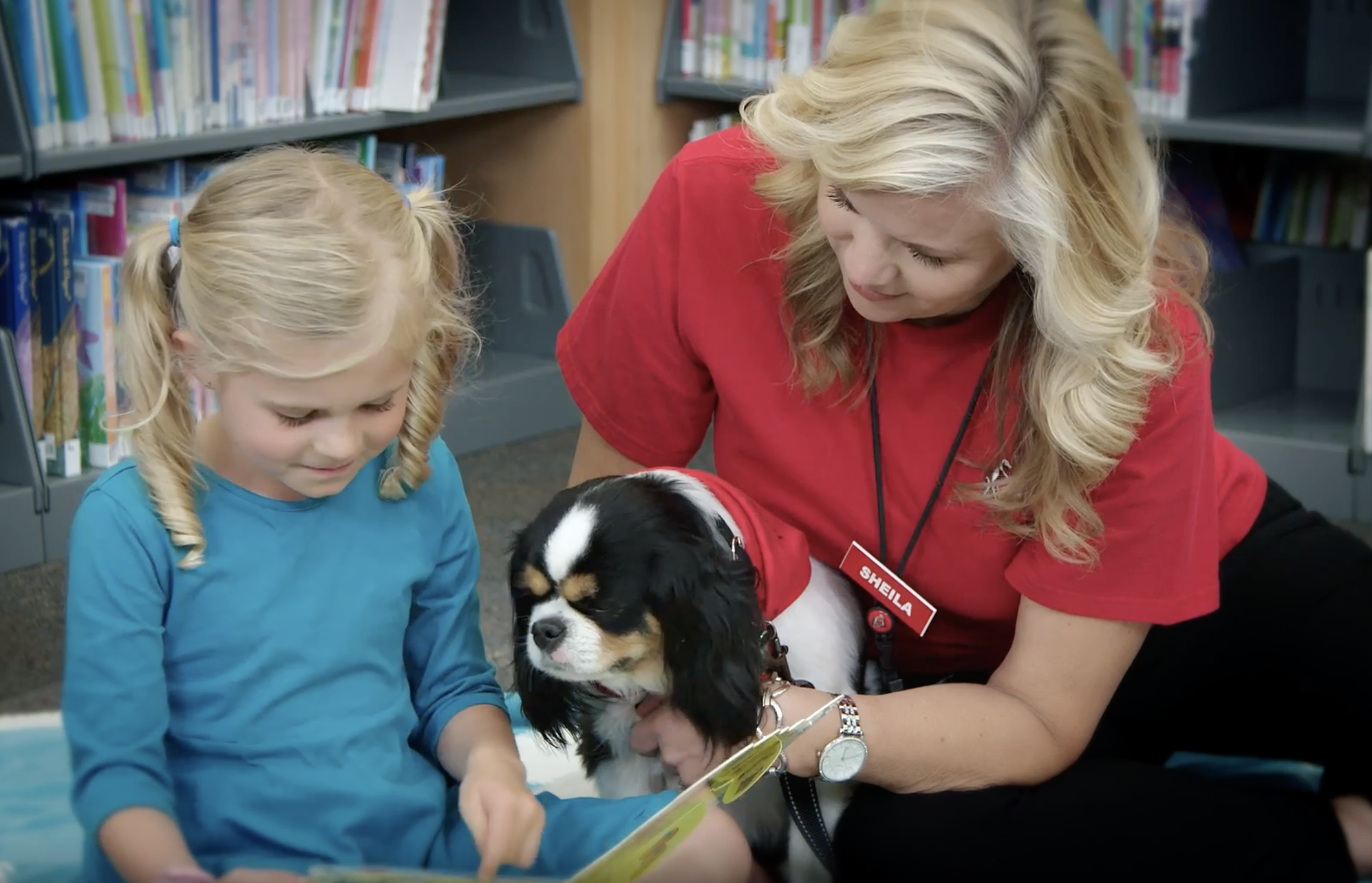 Reading Education Assistance Dogs - Girl with Spaniel